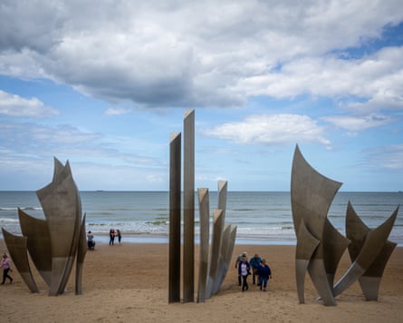 Tourists visit Les Braves monument on Omaha beach in Normandy.Photograph: Christophe Petit-Tesson/EPA