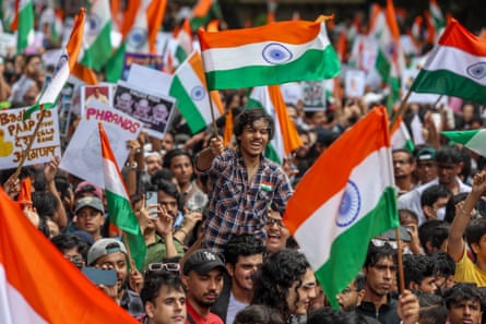 Cockroach Janta party supporters were in a jubilant mood in Mumbai on Sunday after Pradhan’s departure from government.Photograph: Divyakant Solanki/EPA