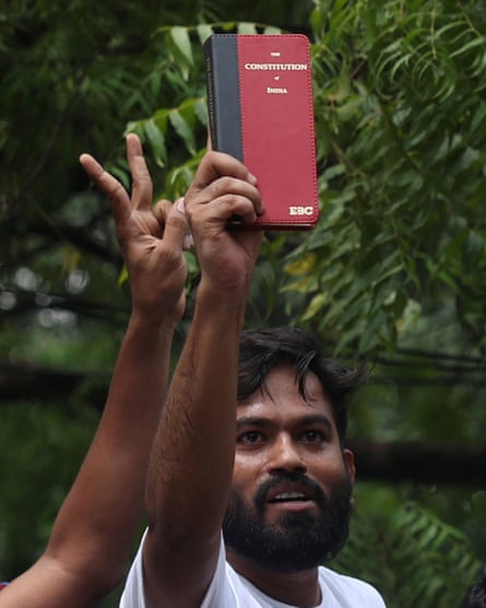 Abhijeet Dipke, the founder of the CJP, celebrated with his fellow protesters in New Delhi on Saturday.Photograph: Francis Mascarenhas/Reuters