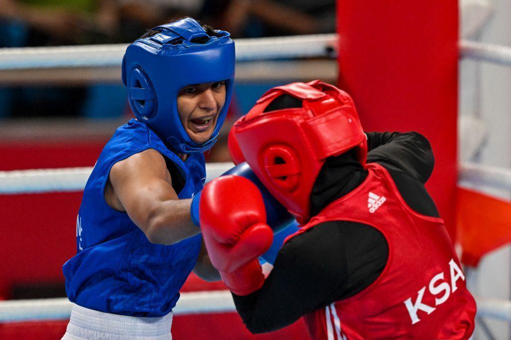 Image caption,Lamboria (left) is the the first female boxer inducted into the Indian Army