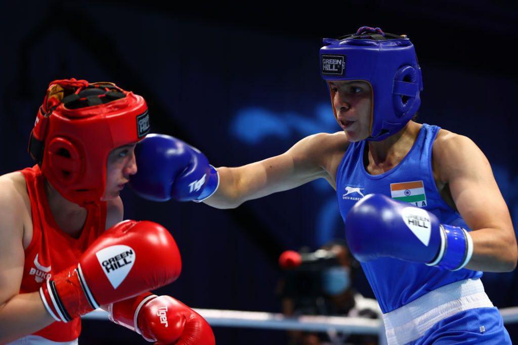 Image caption,Lamboria (right) began boxing seriously when she was around 14 years old