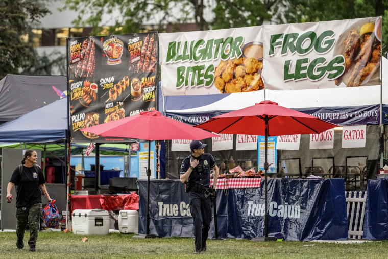 A police officer responding to the shooting at the Bite of Seattle food festival Sunday.Lindsey Wasson / AP