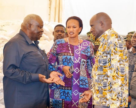 Sam Engola, with the labour minister, Davinia Esther Anyakun, and minister for Karamoja affairs, John Baptist Lokii, at a school in Lodiki.Photograph: Prime minister's office, Uganda