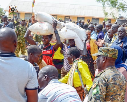Karamoja residents collecting food at the distribution centre.Photograph: PM's office, Uganda