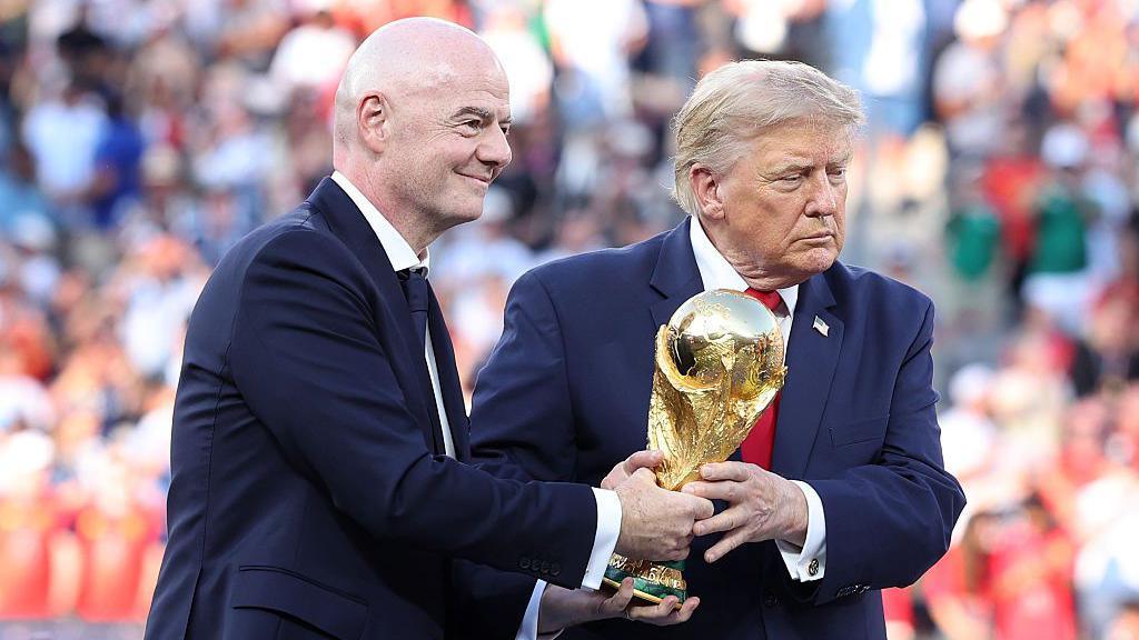 Image caption,President Trump (right) was awarded the Fifa Peace Prize in December