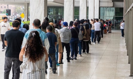 People wait in line to enter the Los Angeles immigration court.Photograph: Myung J Chun/Los Angeles Times/Getty Images