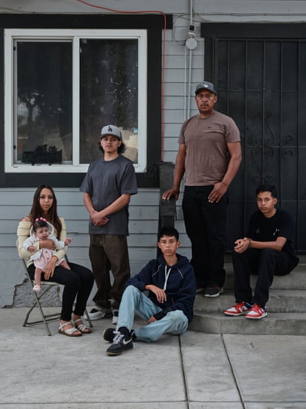 The Longoria family pose for a portrait outside their home.Photograph: Philip Cheung/The Guardian