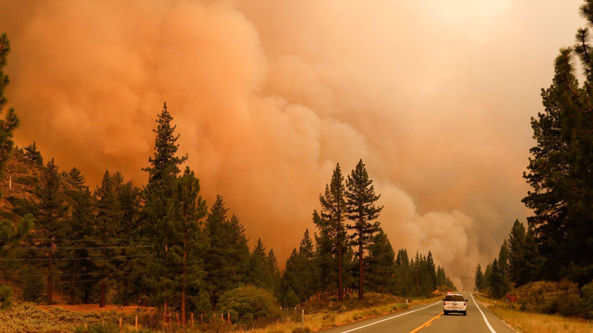 Image caption,Smoke rising in Markleeville, California during the July wildfires in 2021
