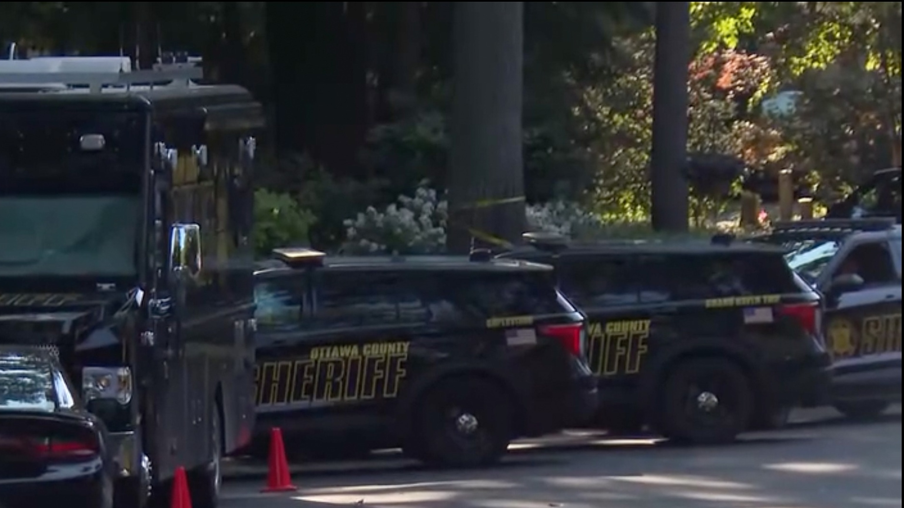 Authorities respond to a deadly house fire in Grand Haven Township, Michigan, July 24, 2026.WZZM