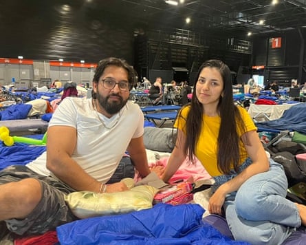 Nassir and Krishma had slept at the exhibition centre for three nights and did not know when they would be allowed home.Photograph: Angelique Chrisafis/The Guardian