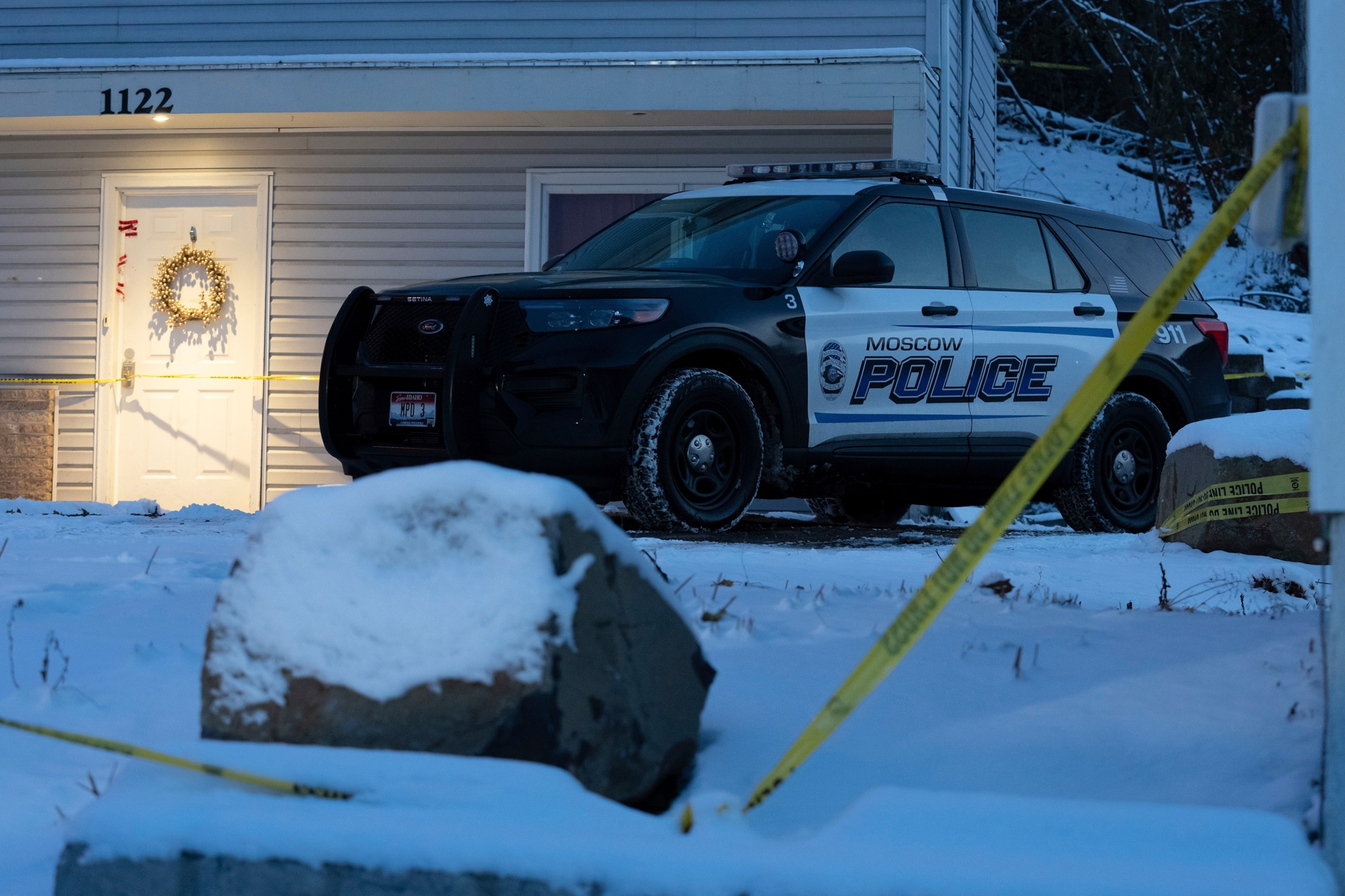 A Moscow police officer stands guard in his vehicle, Tuesday, Nov. 29, 2022, at the home where four University of Idaho students were found dead on Nov. 13, 2022 in Moscow, Idaho.Ted S. Warren/AP