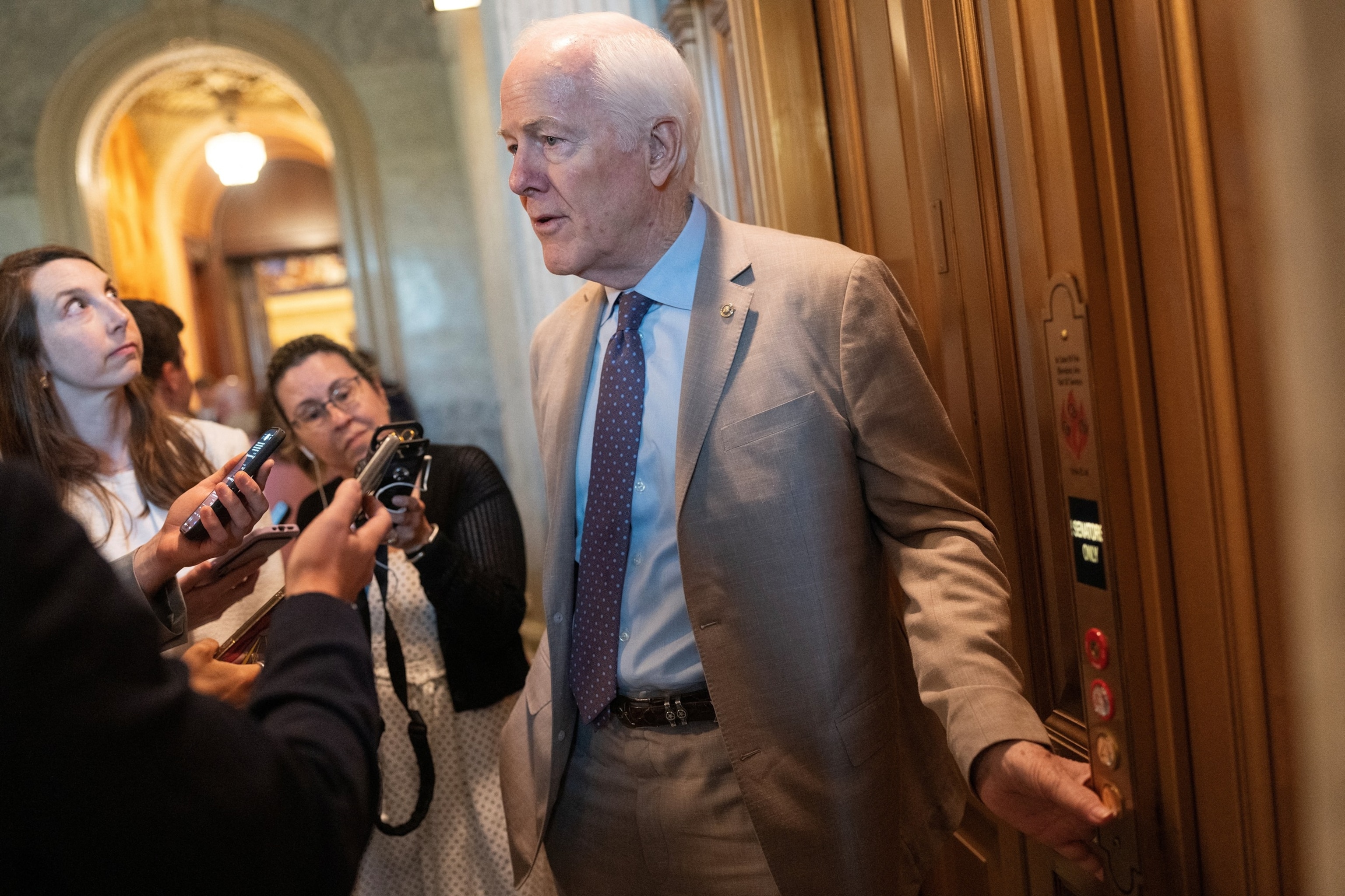 U.S. Sen. John Cornyn, R-Texas, speaks with reporters as he departs following a vote at the U.S. Capitol in Washington, D.C., on July 27, 2026.Nathan Howard/Reuters