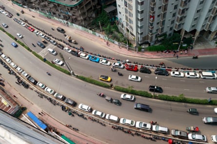People in Dhaka, Bangladesh wait in a long queue as they rush to petrol pumps to refuel amid fears of a shortage in April.Photograph: Suvra Kanti Das/ZUMA Press Wire/Shutterstock