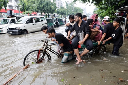 Torrential rain flooded the streets of Dhaka in Bangladesh.Photograph: Mohammad Ponir Hossain/Reuters
