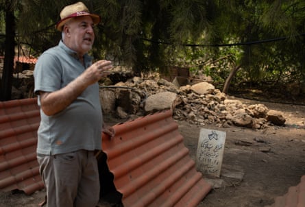 Hamze points out the gravestone of his donkey Blanka at the Mashala shelter.