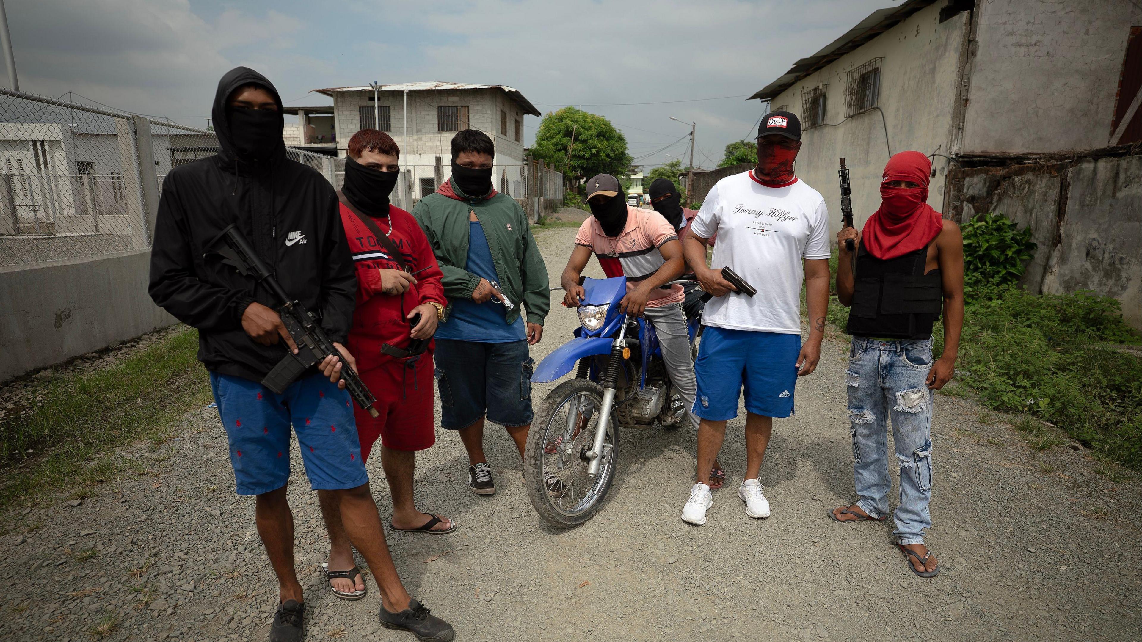 Image caption,Gang members walk openly down the streets in broad daylight with weapons