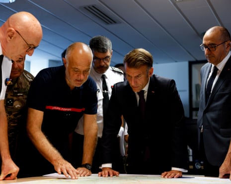 France's President Emmanuel Macron and France's interior minister Laurent Nuñez listen to SDIS 33 Fire and Rescue Service Departemental director Marc Vermeulen during a situation briefing in the crisis room at the Departmental Fire and Rescue Operational Center (CODIS) in Bordeaux.Photograph: Kenzo Tribouillard/POOL AFP/AP