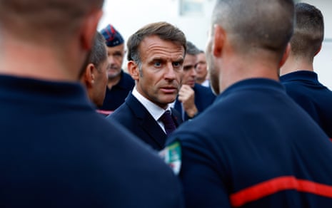 French president Emmanuel Macron speaks with firefighters during a visit to Bordeaux.Photograph: Kenzo Tribouillard/EPA