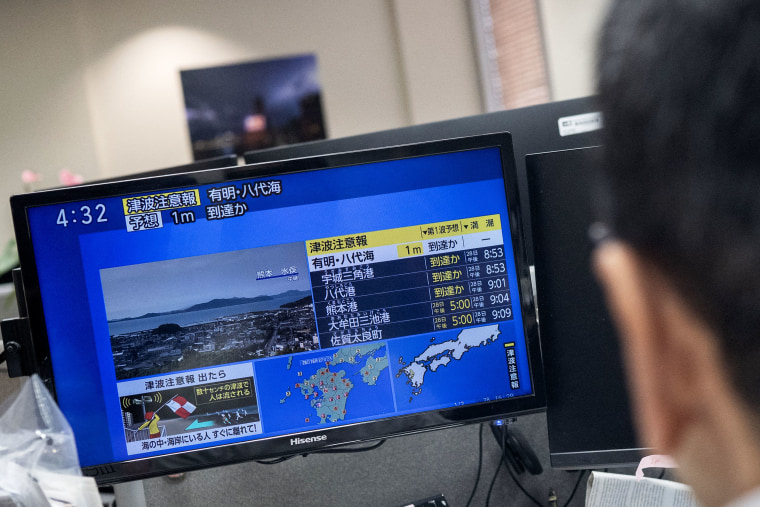 Passengers crowd JR Hakata Station in Fukuoka, southwestern Japan, as bullet train services are suspended on Tuesday.Kyodo via AP