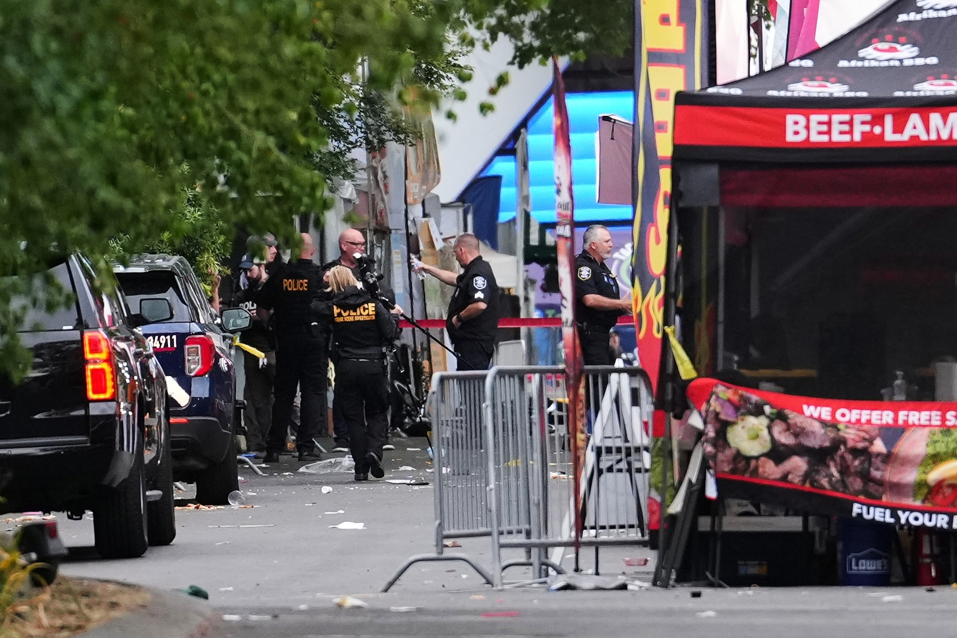 A crime scene photographer arrives as law enforcement examines the scene following a shooting at Seattle Center during the Bite of Seattle food festival, July 26, 2026, in Seattle.Lindsey Wasson/AP Photo