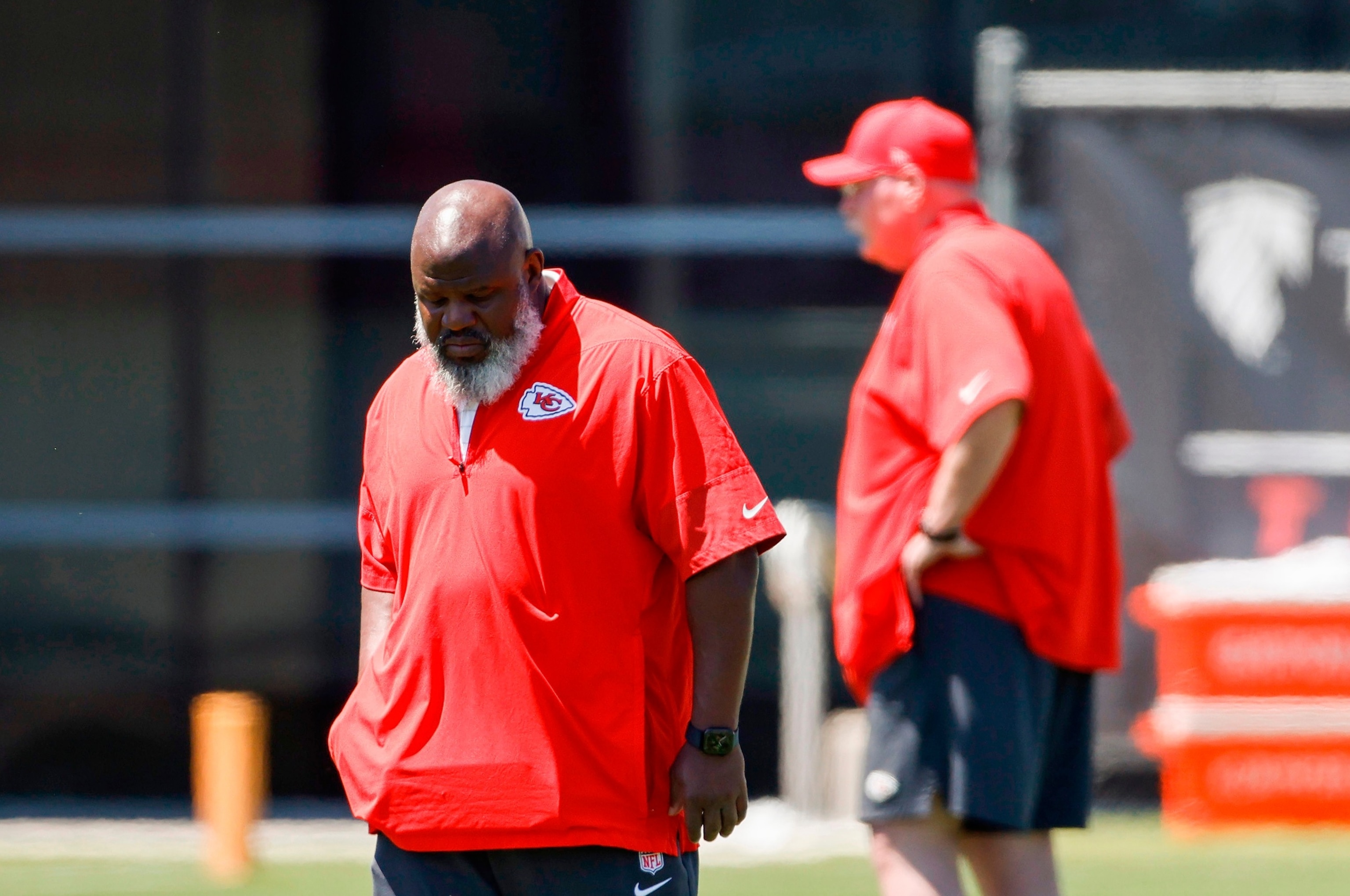 Kansas City Chiefs offensive coordinator Eric Bieniemy, left, walks upfield during the second day of the NFL football team's rookie minicamp in Kansas City, Mo., May 2, 2026.Colin E. Braley/AP