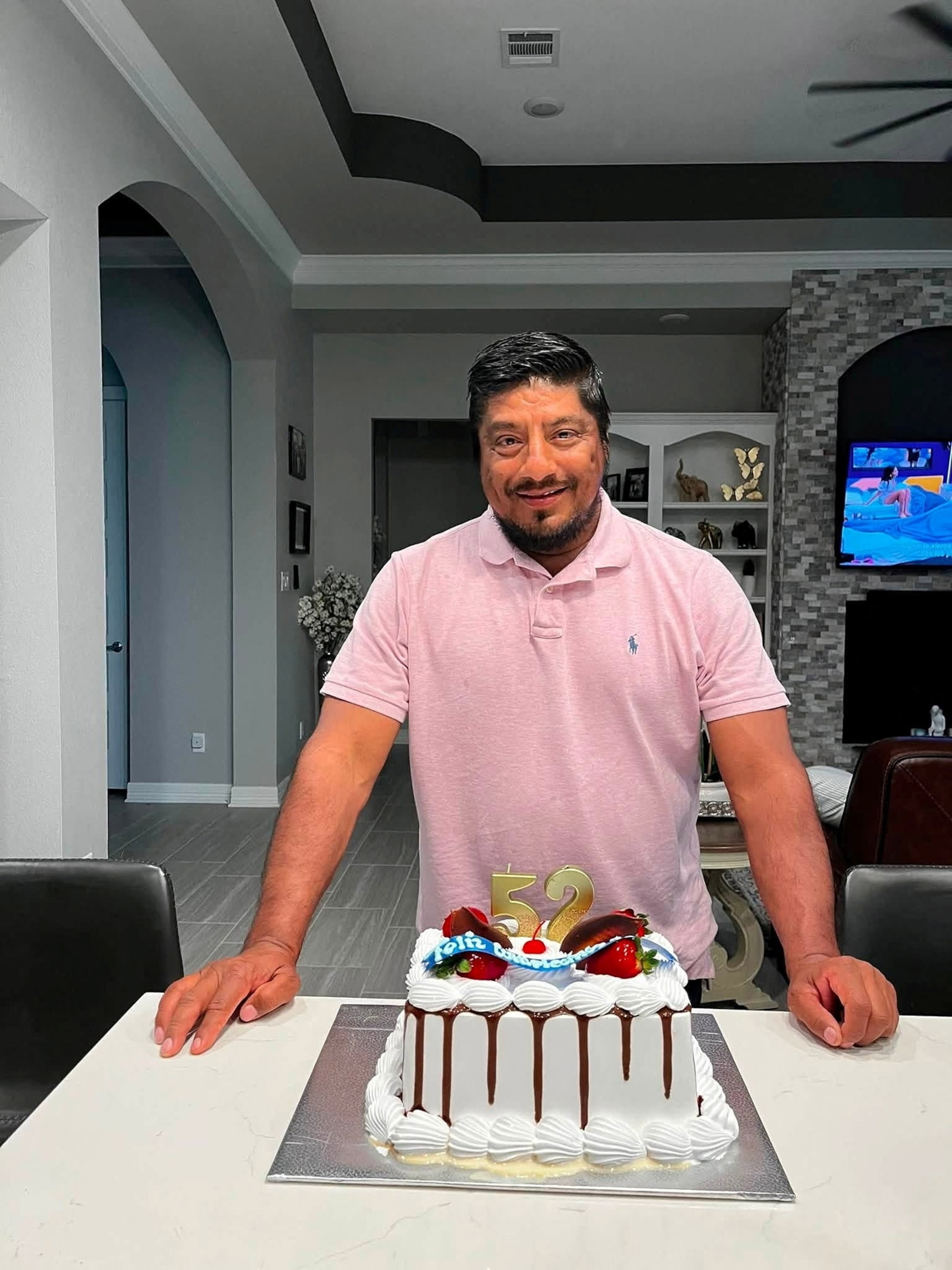 Lorenzo Salgado Araujo, a Mexican motorist who was fatally shot by an ICE agent during a vehicle stop in Houston, stands behind a birthday cake in an unknown location in this this picture obtained from social media, released July 8, 2026.Ronaldo Salgado via Reuters