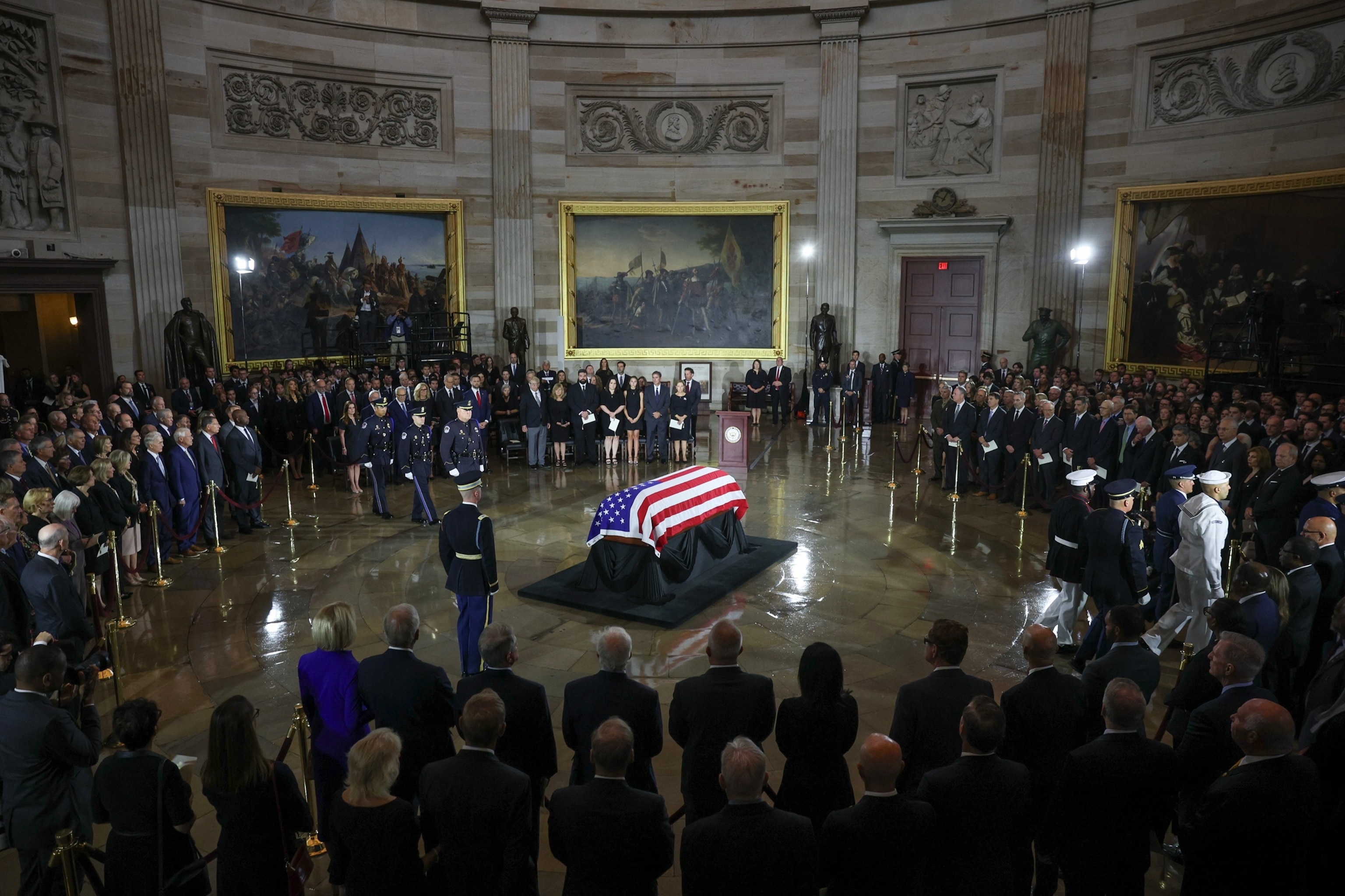 An Armed Forces Body Bearer Team carry the casket of the late U.S. Sen. Lindsey Graham past his sister, Sen. Darline Graham during a memorial tribute at the U.S. Capitol, July 28, 2026 in Washington.Finn Gomez/Getty Images