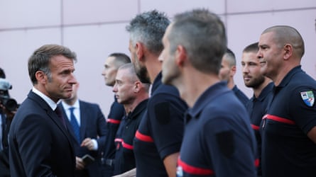 Emmanuel Macron with firefighters on a visit to the fire and rescue operational centre in Bordeaux on Monday.Photograph: Kenzo Tribouillard/EPA