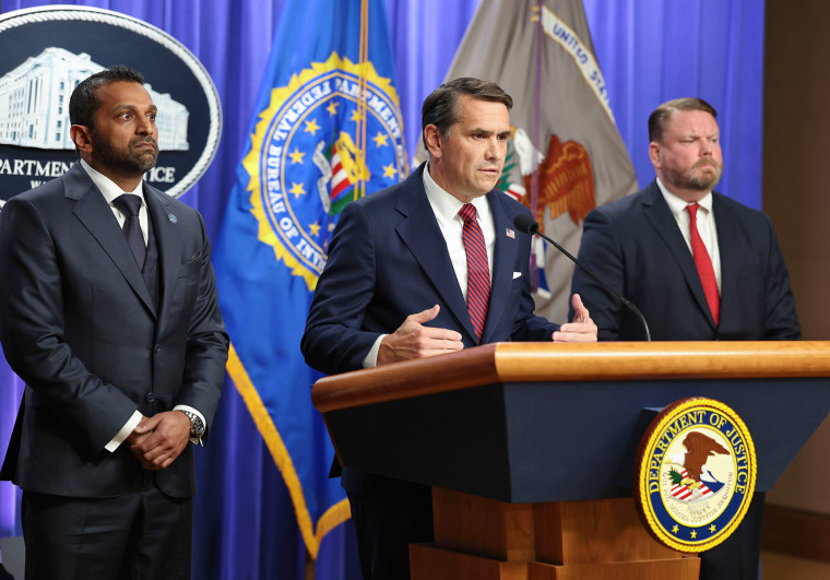 Acting Attorney General Todd Blanche, flanked by FBI Director Kash Patel, left, and W. Ellis Boyle, the U.S. attorney for the Eastern District of North Carolina, announces charges against Comey on April 28.Tasos Katopodis / Getty Images