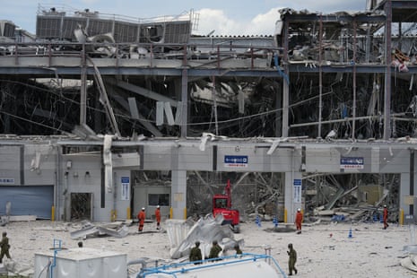 Aeon shopping centre was damaged by an explosion following the earthquake.Photograph: Hiro Komae/AP