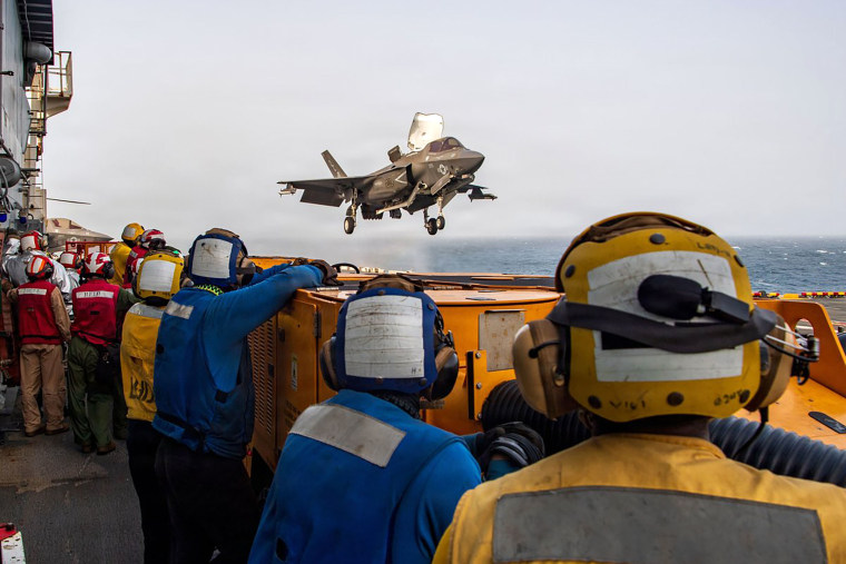 U.S. service members support flight operations from the Arabian Sea, in an official photo shared on July 20.@CENTCOM / via X