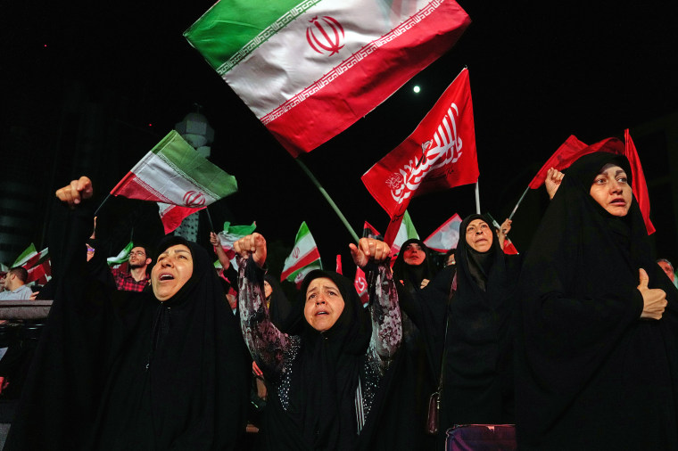 Iranian pro-government demonstrators gather in Tehran on Tuesday.Vahid Salemi / AP