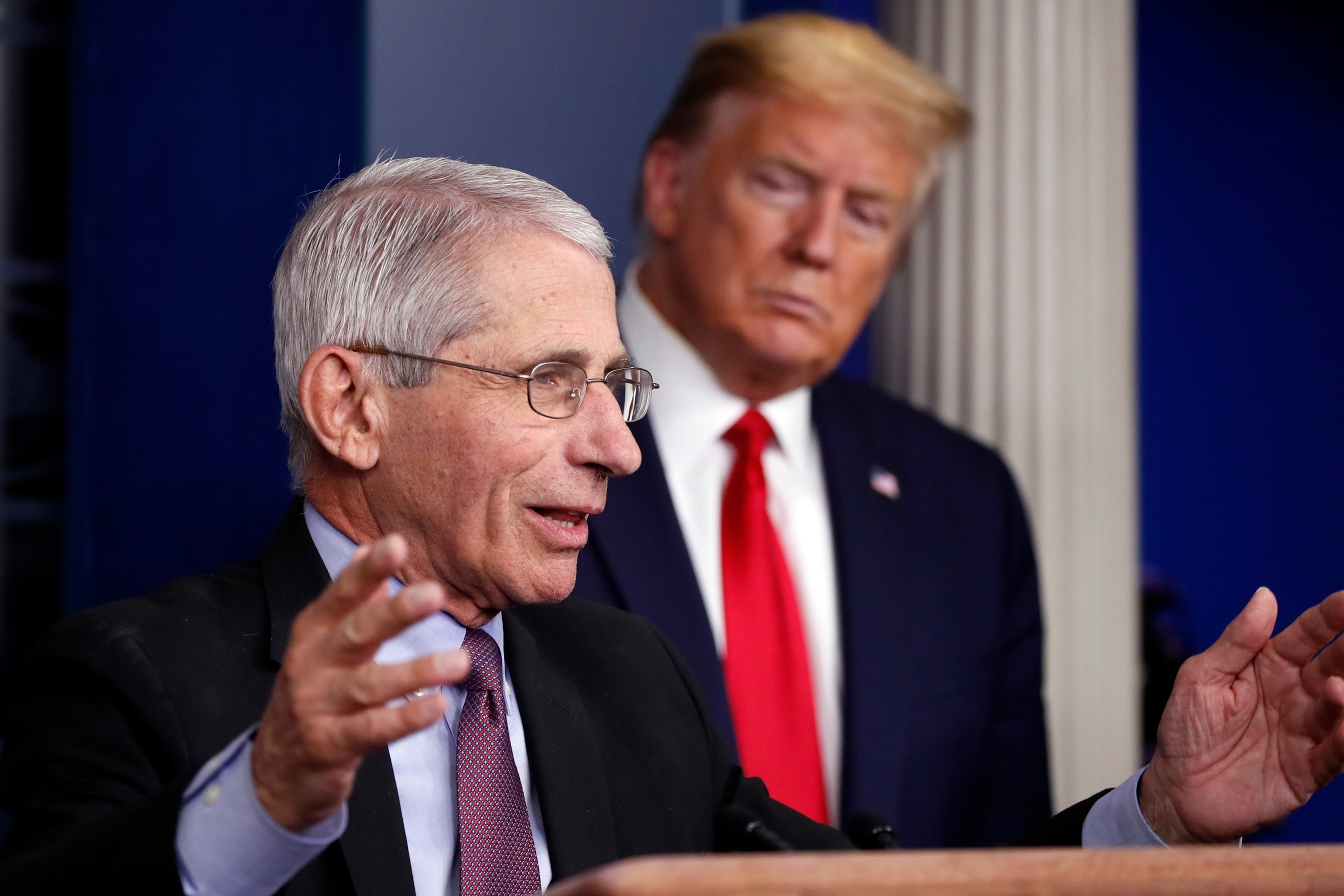 In this April 22, 2020, photo President Donald Trump watches as Dr. Anthony Fauci, director of the National Institute of Allergy and Infectious Diseases, speaks about the coronavirus in the James Brady Press Briefing Room of the White House in Washington, D.C.Alex Brandon/AP