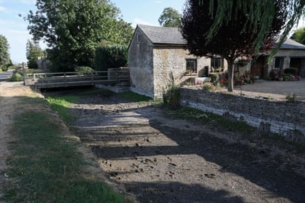 The Thames has run dry at Ashton Keynes, Wiltshire, close to its source. In England, 78% of rivers are now at below normal or lower levels.Photograph: Toby Melville/Reuters