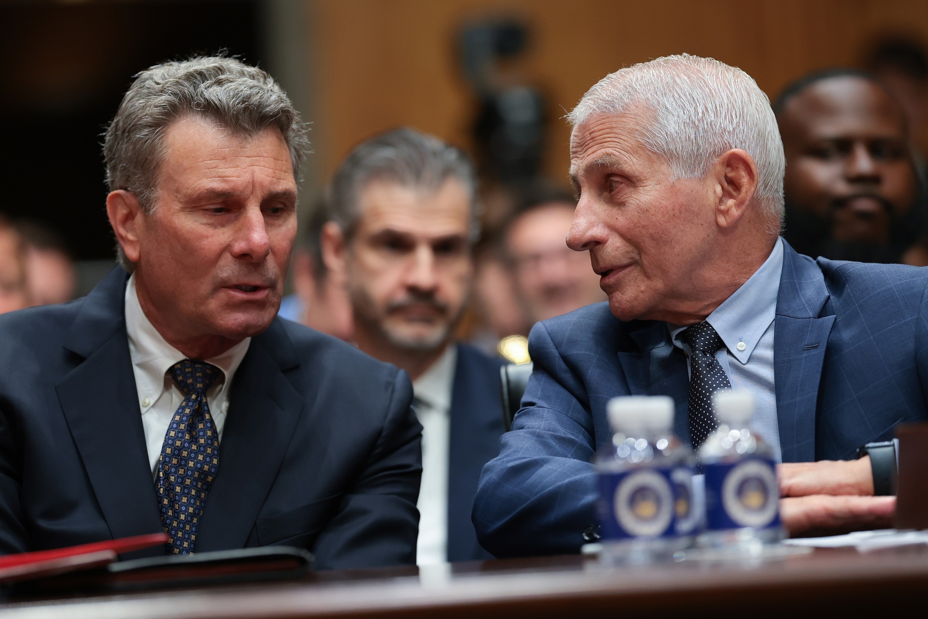 Former NIH Director Anthony Fauci consults with his attorney David Schertler as he testifies before a Senate Homeland Security and Governmental Affairs Committee hearing, July 29, 2026 in Washington.Anna Moneymaker/Getty Images