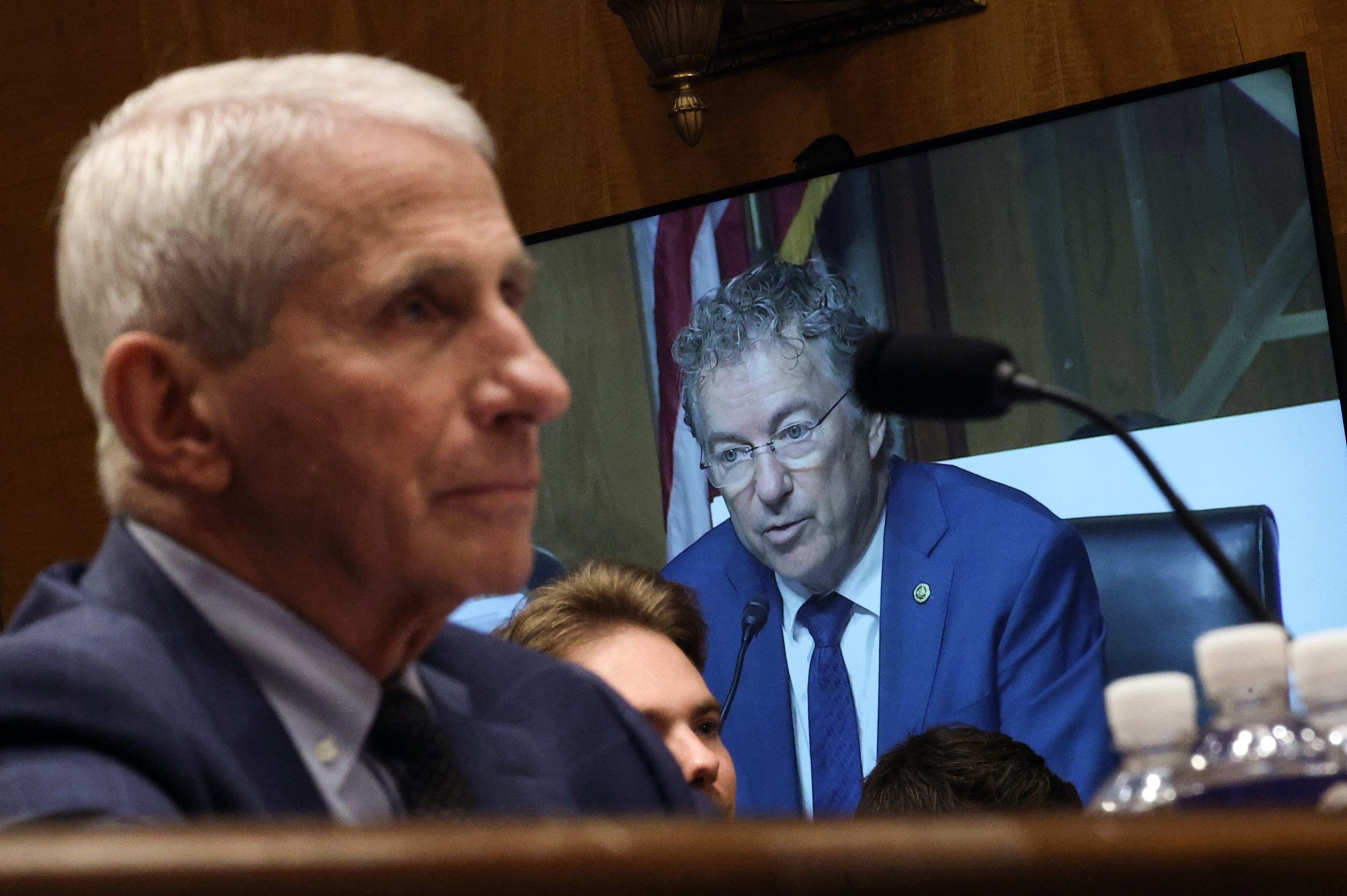 WASHINGTON, DC - JULY 29: Committee Chairman U.S. Sen. Rand Paul (R-KY) is shown on a monitor as former NIH Director Anthony Fauci (L) testifies before the Senate Homeland Security and Governmental Affairs Committee hearing on July 29, 2026 in Washington, DC. Fauci was expected to be questioned about his diary entries during his handling of the Covid-19 pandemic. (Photo by Kevin Dietsch/Getty Images)Kevin Dietsch/Getty Images