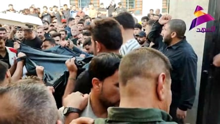 The group funeral for militia fighters killed in US-Saudi airstrikes.Photograph: Hadi Mizban/AP