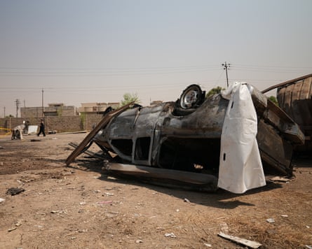 People carry bodies on Wednesday after members of Iraq’s Popular Mobilisation Forces were killed in strikes by the US.Photograph: Al Ahad/Reuters