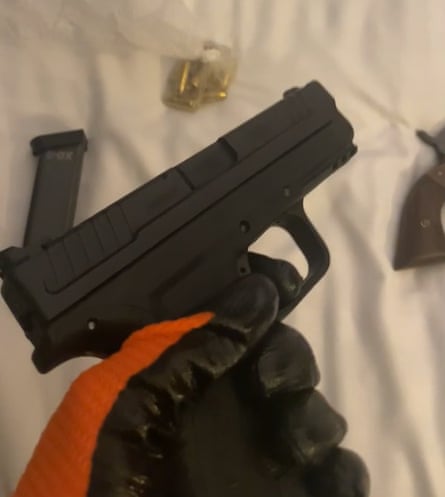 Photo issued by the Metropolitan police of Johannes Natland wearing gloves while handling a gun.Photograph: Metropolitan police/PA