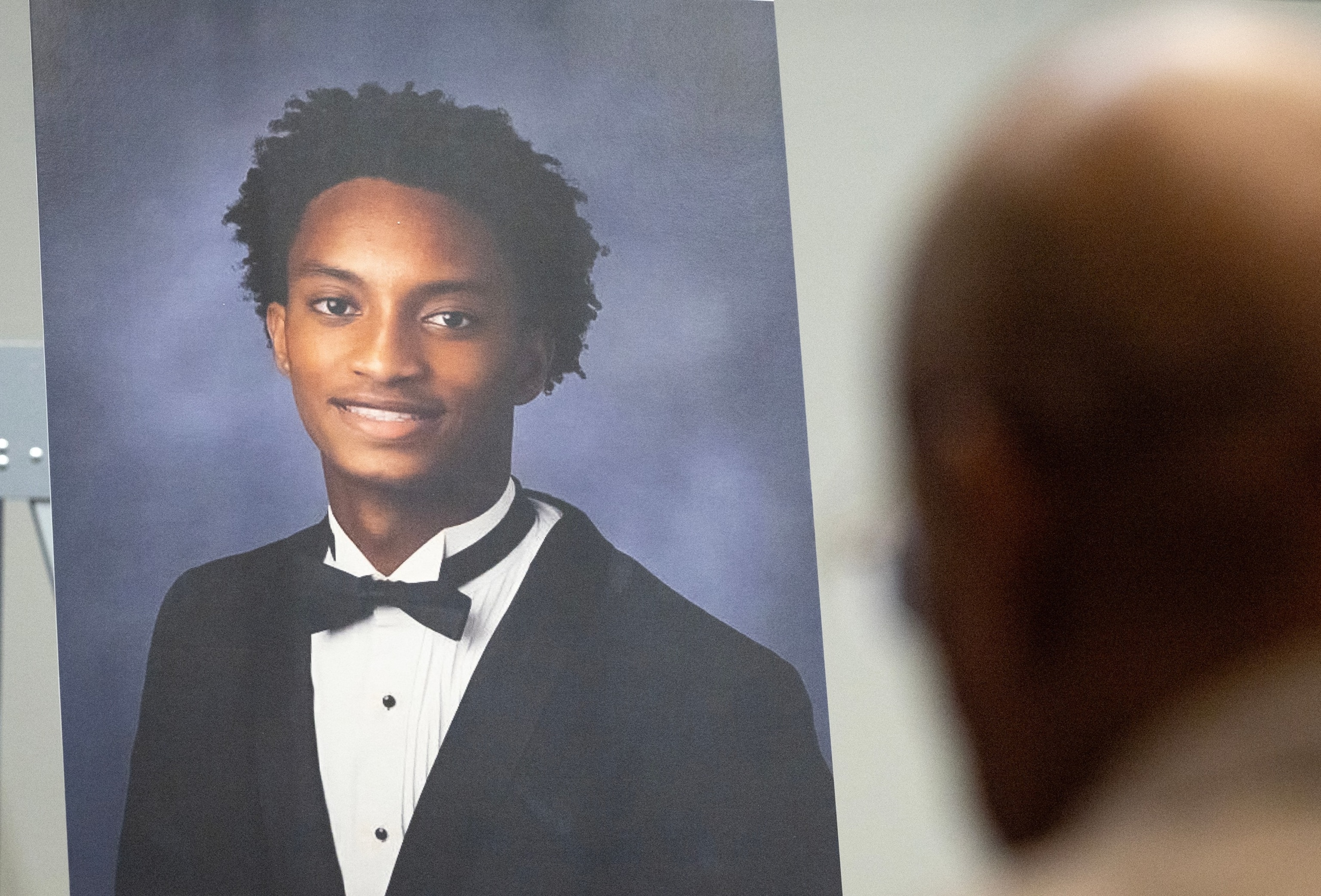 A photo of Nolan Wells is displayed on stage where Ben Crump, a lawyer for the family of Nolan Wells announces the results of an independent autopsy as they investigate the death of Wells, July 22, 2026 in Chicago.Scott Olson/Getty Images