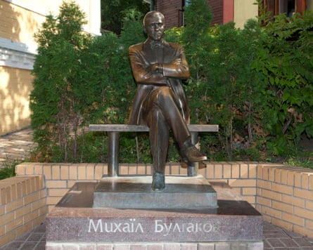 A statue of the writer Mikhail Bulgakov (1891-1940) at his former house in Kyiv, Ukraine.Photograph: De Rocker/Alamy