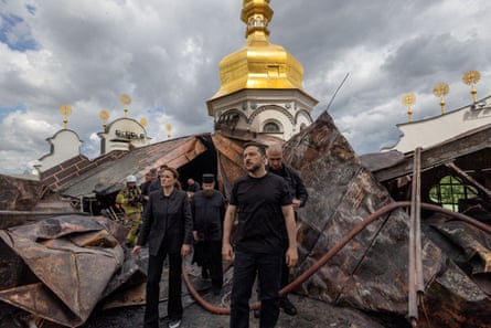 Volodymyr Zelenskyy and the Ukrainian prime minister, Yulia Svyrydenko (left), visit the Dormition Cathedral of Pechersk Lavra, which was hit by Russian strikes in June.Photograph: Ukrainian Presidential Press Service/Reuters