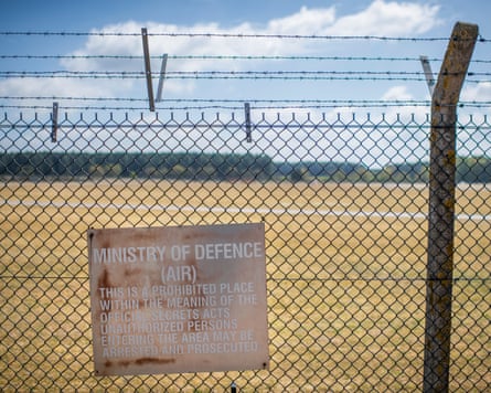 A sign on a fence outside the runway of RAF Lakenheath.Photograph: Joshua Bright/The Guardian