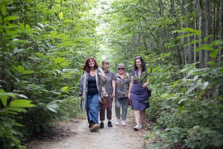 Rachel Rodwell, Allison Sweetman, Julie Read and Brontie Ansell walk through Oaken Wood.Photograph: Graeme Robertson/The Guardian