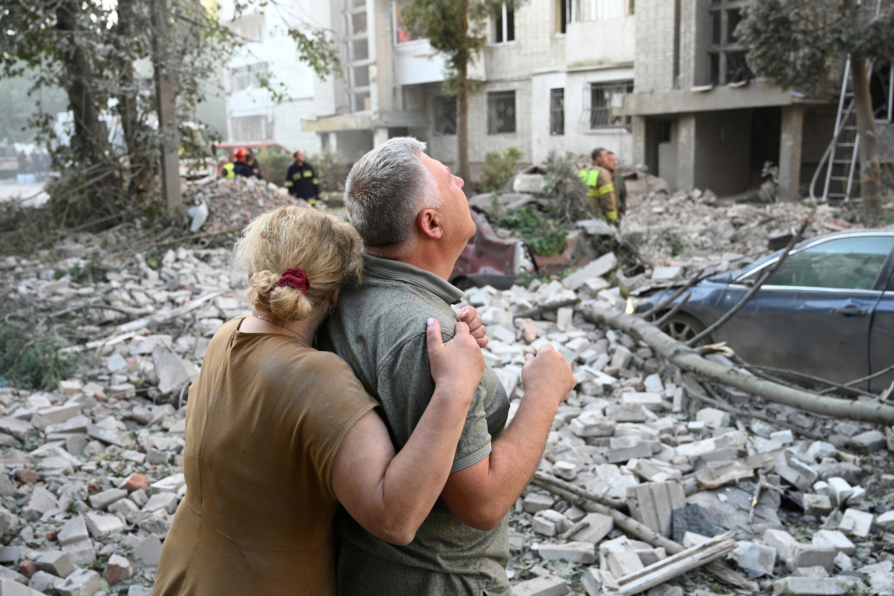 Local residents react outside a residential building partially destroyed as a result of Russian missile strikes in the western Ukrainian city of Lviv on July 30, 2026.Yuriy Dyachyshyn/AFP via Getty Images