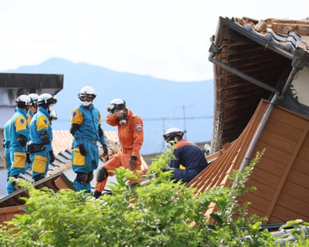 Rescue operations continue at a collapsed house in Yatsushiro City.Photograph: Jiji Press/EPA