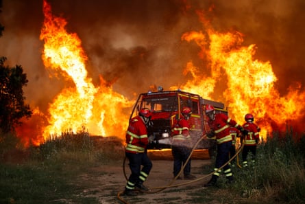 Firefighters in Cercosa, Portugal, battling a wildfire this month.Photograph: Paulo Cunha/EPA