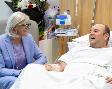 Mostyn visiting Ahmed al-Ahmad in hospital, who disarmed a gunman during the Bondi Beach shooting.Photograph: Anadolu/Getty Images