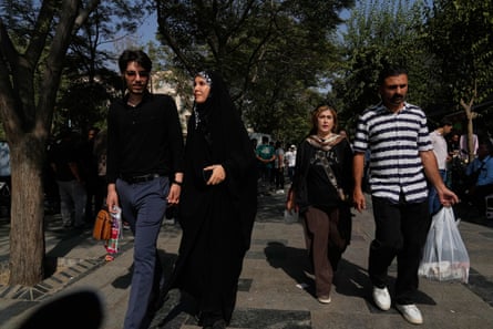 People walk through Tehran’s Grand Bazaar. Food prices are increasing as inflation rises, yet the value of the minimum wage has plummeted.Photograph: Vahid Salemi/AP
