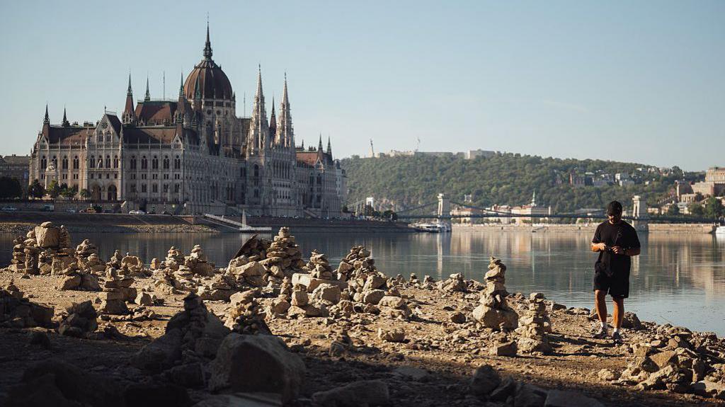 Image caption,Large areas of the riverbed have been exposed in the centre of Budapest after weeks of extreme heat and drought